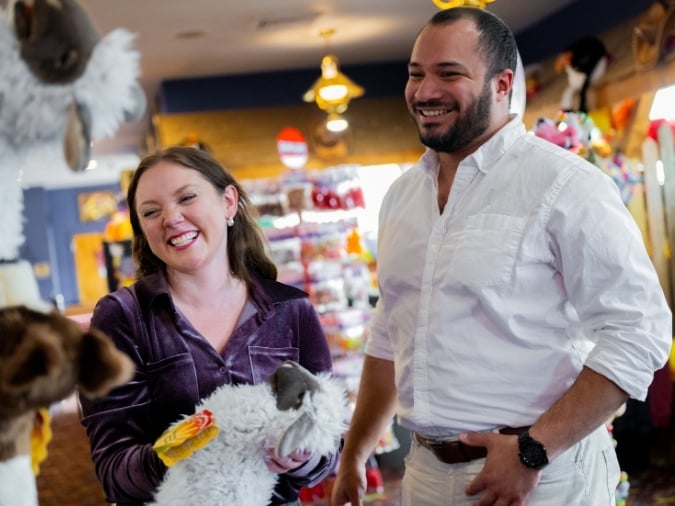 A couple is enjoying browsing the retail shop.