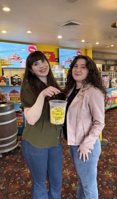 2 guests enjoying popcorn