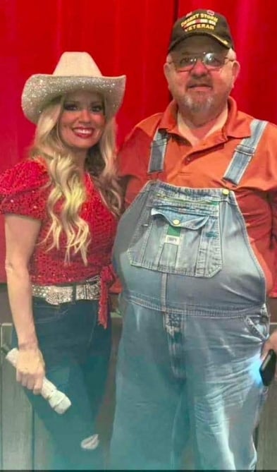 A guest and Kendall from the Comedy Barn band.