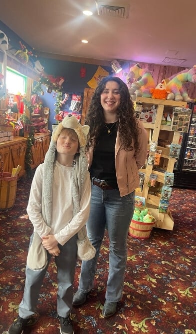 2 young guests explore the Comedy Barn retail area.