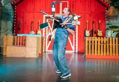 juggler at The Comedy Barn with items like knives 