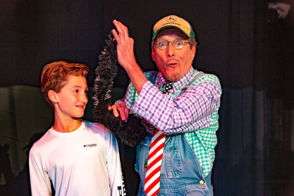 Audience member participating in Comedy Barn show