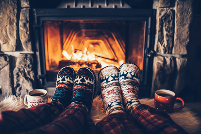 couple's socks in front of the fire