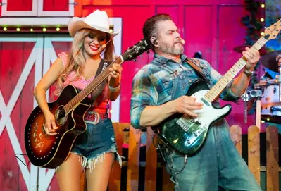 singers at the Comedy Barn playing guitars