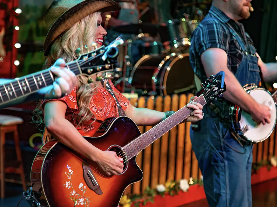performers with instruments at The Comedy Barn